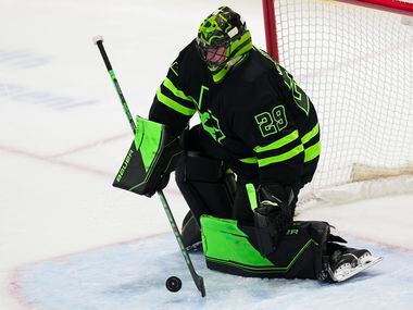 Dallas Stars goaltender Jake Oettinger (29) turns away a shot during the third period of an...