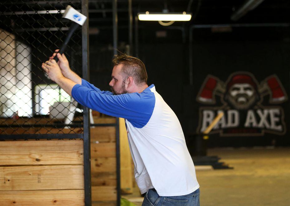 Anthony McGacock demonstrates ax throwing at Bad Axe Throwing in Dallas, which opened in June.