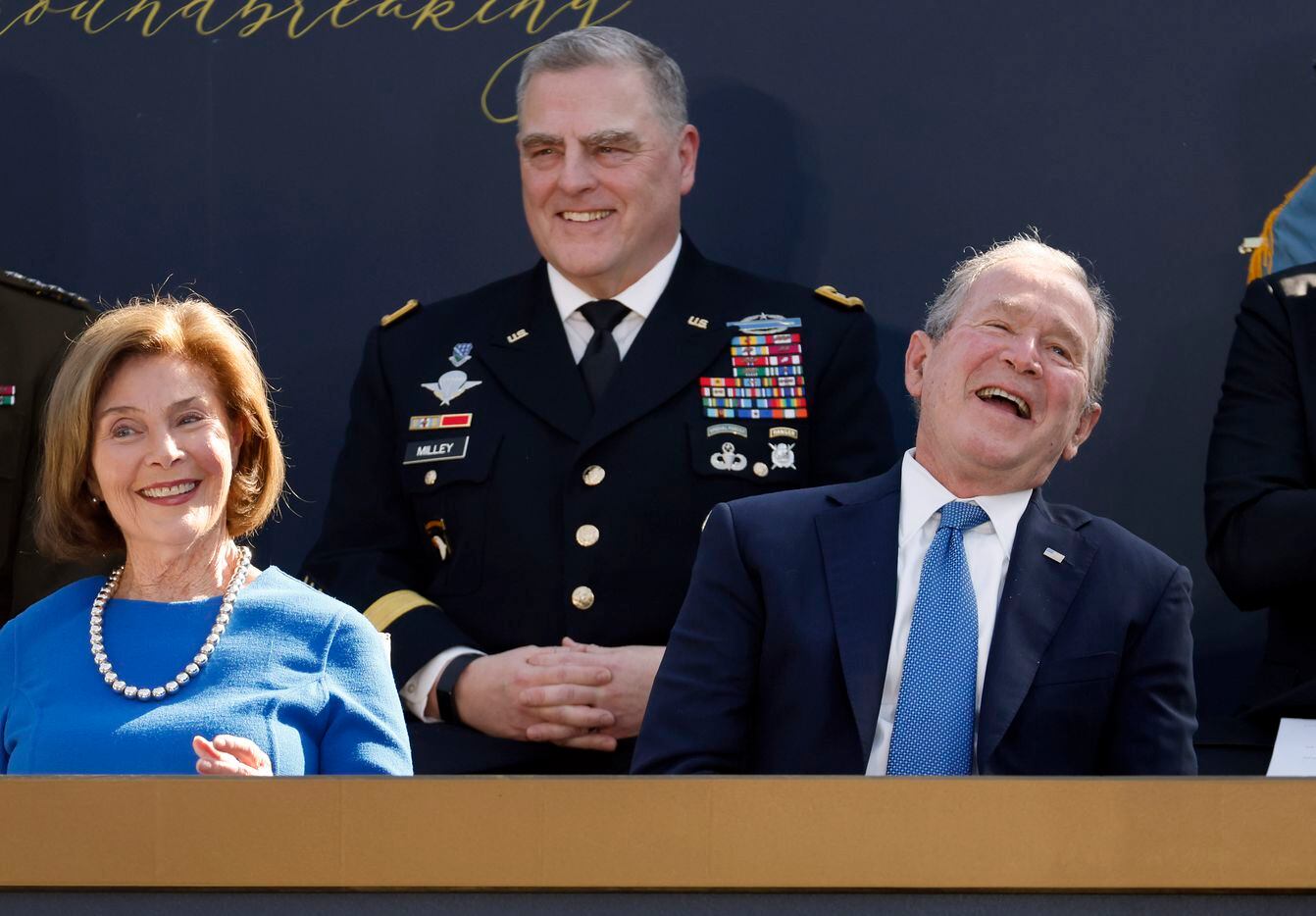 Former President George W. Bush and wife Laura and Chairman of the Joint Chiefs of Staff...