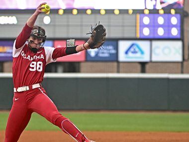 Oklahoma starting pitcher Jordy Bahl throws to an LSU batter during an NCAA college softball...