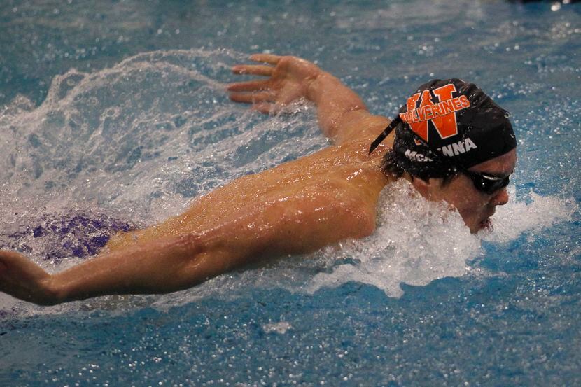Frisco Wakeland's Conor McKenna powers to the finish line to win the Boys 100 yard Butterfly...