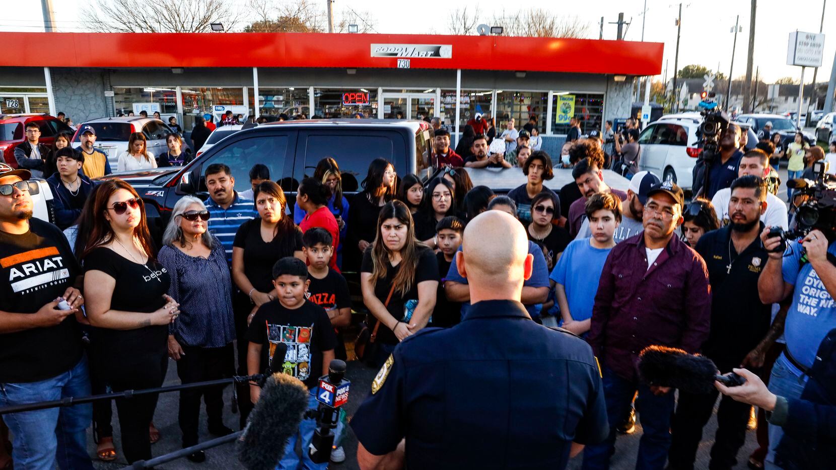 Garland police Lt. Pedro Barineau, a department spokesman, addresses the family members and...