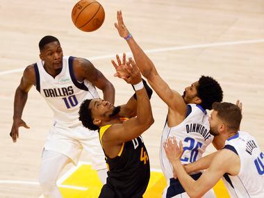 Dallas Mavericks guard Spencer Dinwiddie (26) defends as Utah Jazz guard Donovan Mitchell...