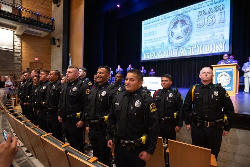 Police Officers from Class 381, including Geovanny Mendoza-Rosales, second from right, front...