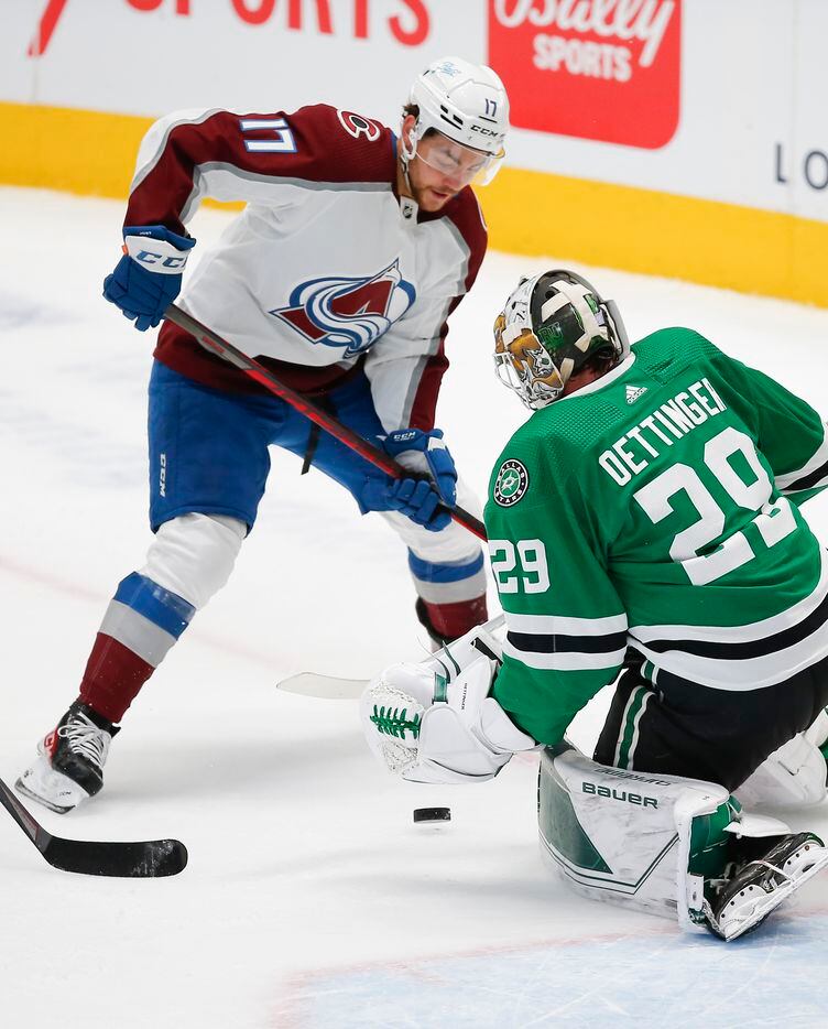 Colorado Avalanche forward Tyson Jost (17) looks for the rebound as Dallas Stars goaltender Jake Oettinger (29) defends during the first period of an NHL hockey game in Dallas, Friday, November 26, 2021. (Brandon Wade/Special Contributor)