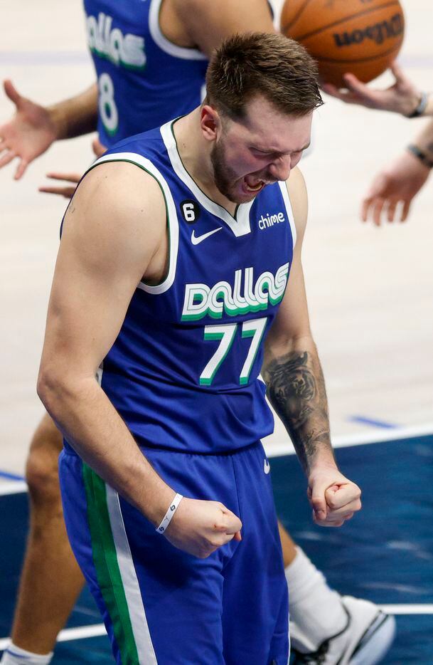 Dallas Mavericks guard Luka Doncic (77) reacts after making a shot while being fouled during...