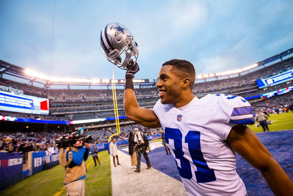 FILE - Dallas Cowboys cornerback Byron Jones celebrates as he leaves the field after a 36-35...