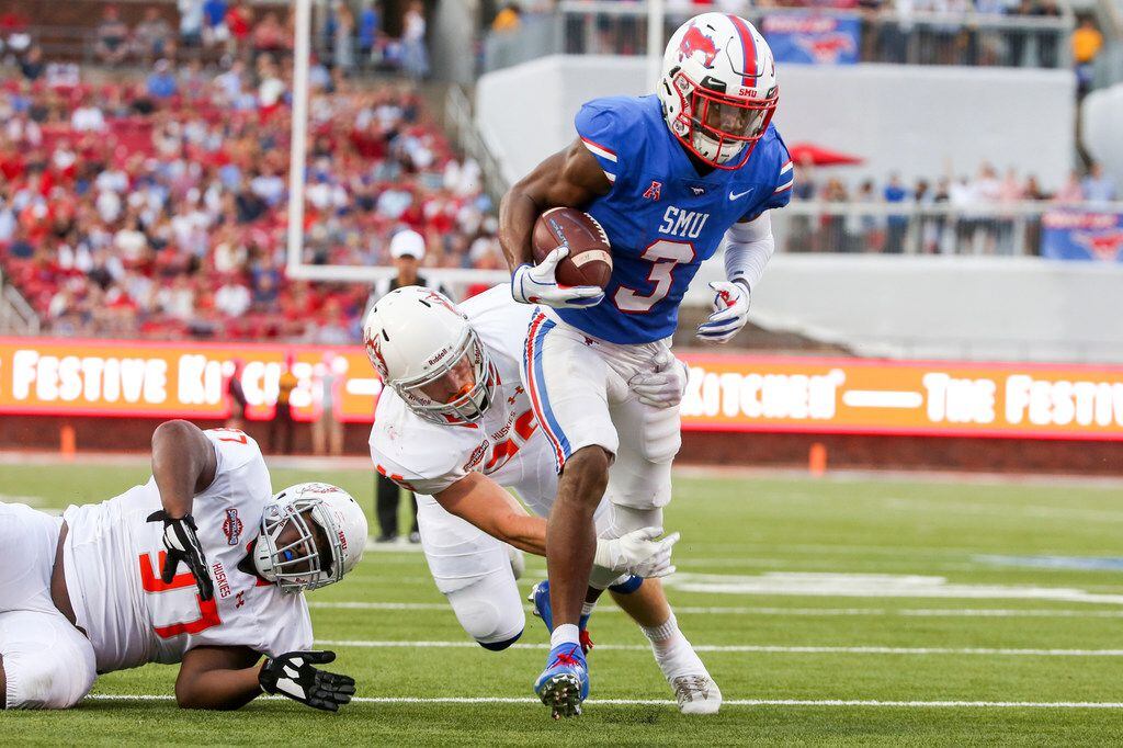 Southern Methodist Mustangs wide receiver James Proche (3) carries the ball to score a touchdown past Houston Baptist Huskies guard Emmanuel Mann (97) and linebacker Kyle Bowling (25) during the first half of an NCAA football game between Southern Methodist Mustangs and Houston Baptist on Saturday, September 29, 2018 at Ford Stadium in Dallas. (Shaban Athuman/The Dallas Morning News)