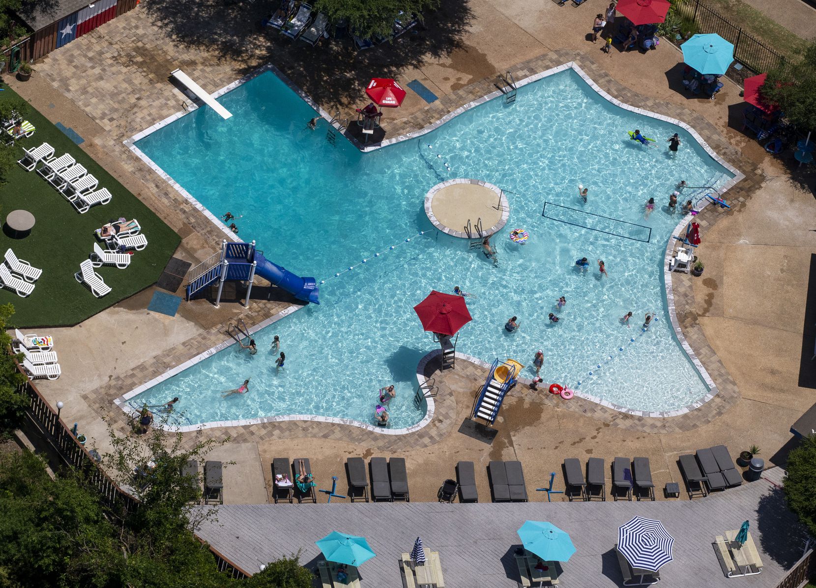 People enjoy the Texas Pool in Plano, Texas, on Thursday, June 18, 2020.