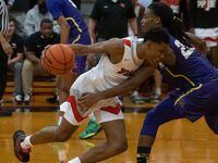 A player from Lake Highlands High School gets blocked by Richardson High School Cason Wallace (22) from advancing up the court during at Lake Highlands High School in Dallas, Tuesday, January 18, 2022. Richardson High School won 85 to 78.