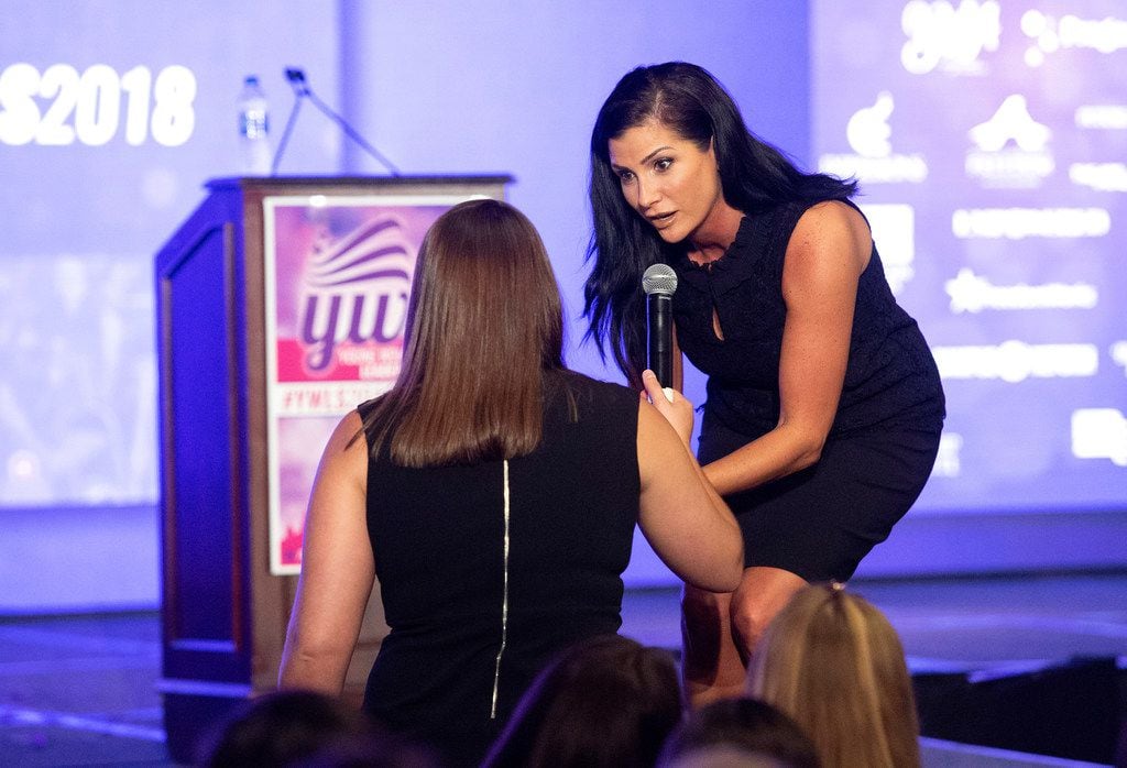 Conservative political commentator Dana Loesch signs a book for an attendee at the Turning Point USA Young Women's Leadership Summit, a conference for young conservative women, on Thursday, June 14, 2018, at the Hyatt Regency Hotel at DFW International Airport. 