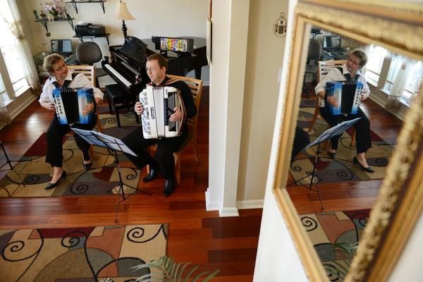 
Elena and Gregory Fainshtein play the accordion in their Plano home.
