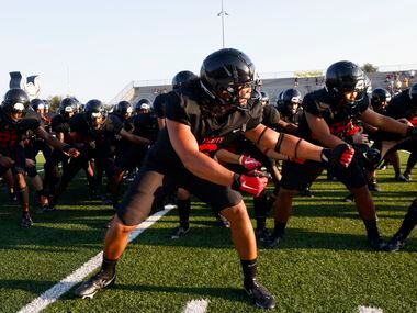 Euless Trinity defender Nai Mose leads the team in the haka dance prior to playing Arlington...