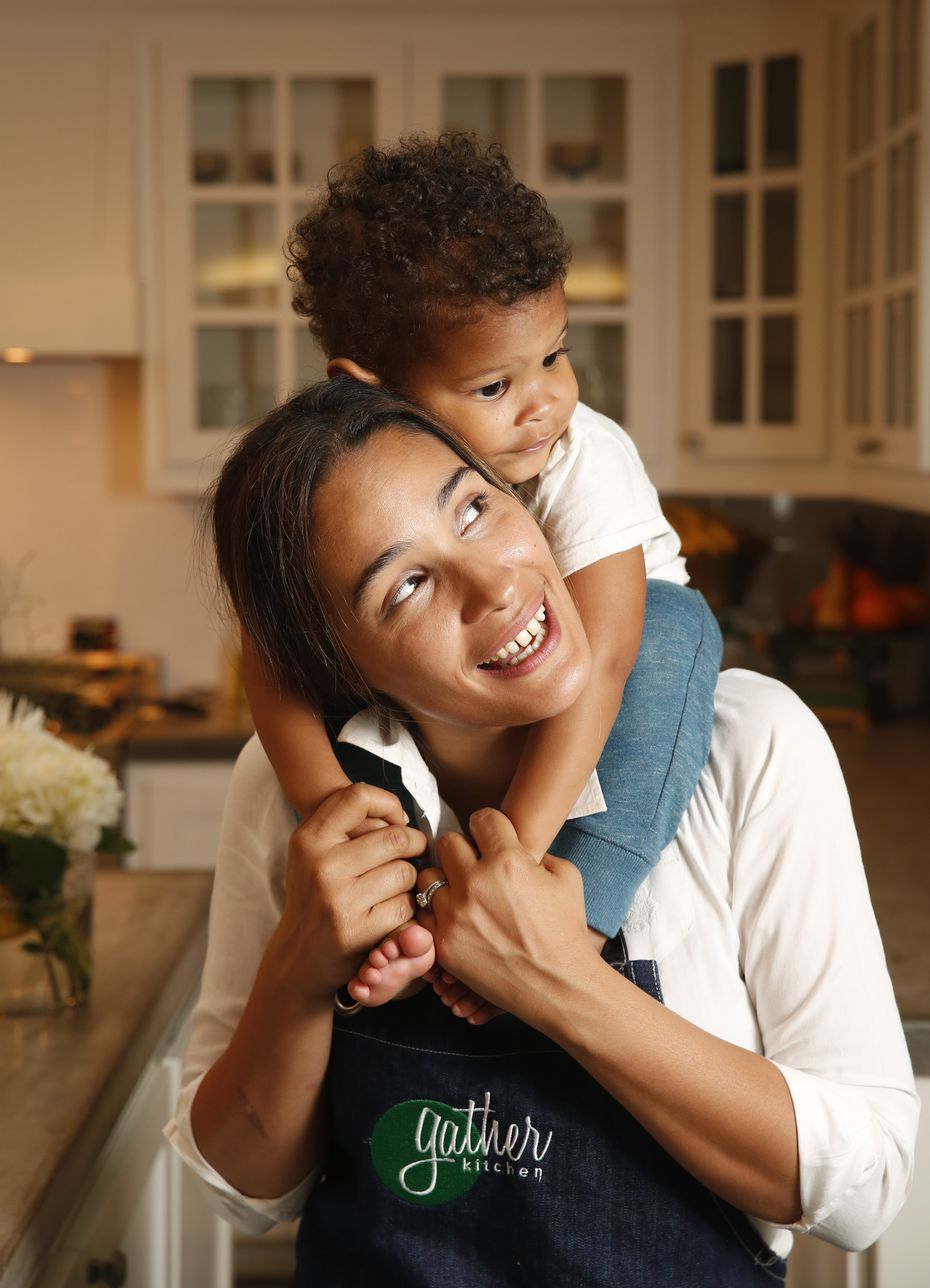Chef Soraya Spencer, owner of Gather Kitchen, poses for a photograph with her two-year-old son Ethan Zeine in 2019. Spencer has temporarily closed her downtown Dallas restaurant.