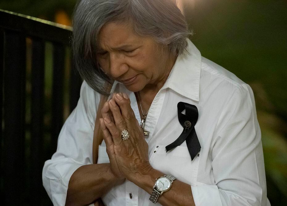 Irma Fuentes prays following an emergency mass held by Archbishop Gustavo García-Siller at...