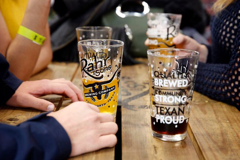 Guests drink beer and converse at Rahr & Sons Brewing Company's weekly tour and tasting in...
