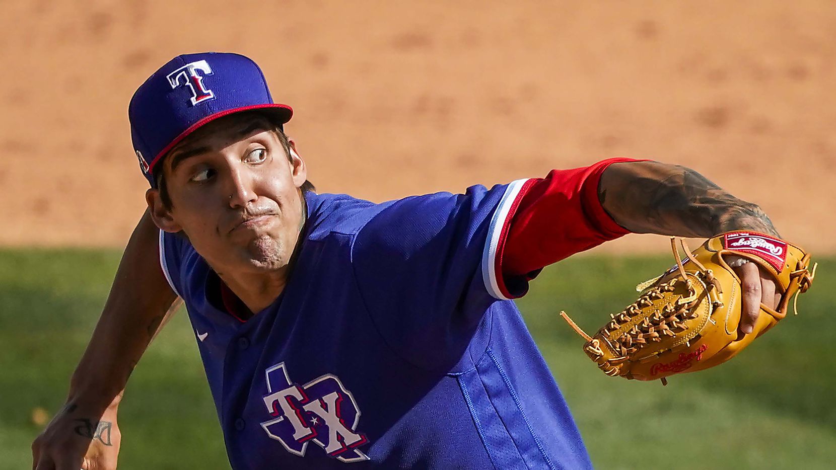 Texas Rangers pitcher Hans Crouse delivers during the fifth inning of a spring training game against the Los Angeles Angels at Tempe Diablo Stadium on Wednesday, March 3, 2021, in Tempe, Ariz. 