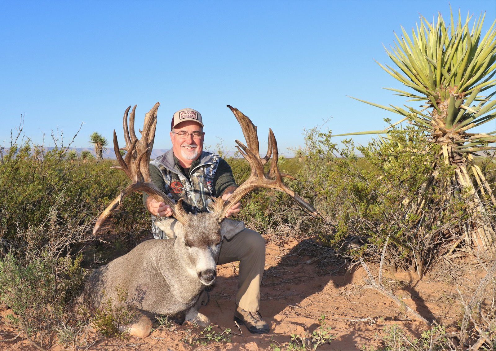 Greg Simons, of San Angelo, with his outstanding non-typical mule deer buck taken Nov. 4 in...