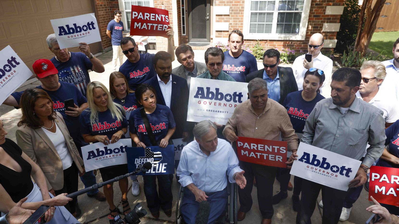 Texas Governor Greg Abbott takes questions from the members of the media as he campaigns in...