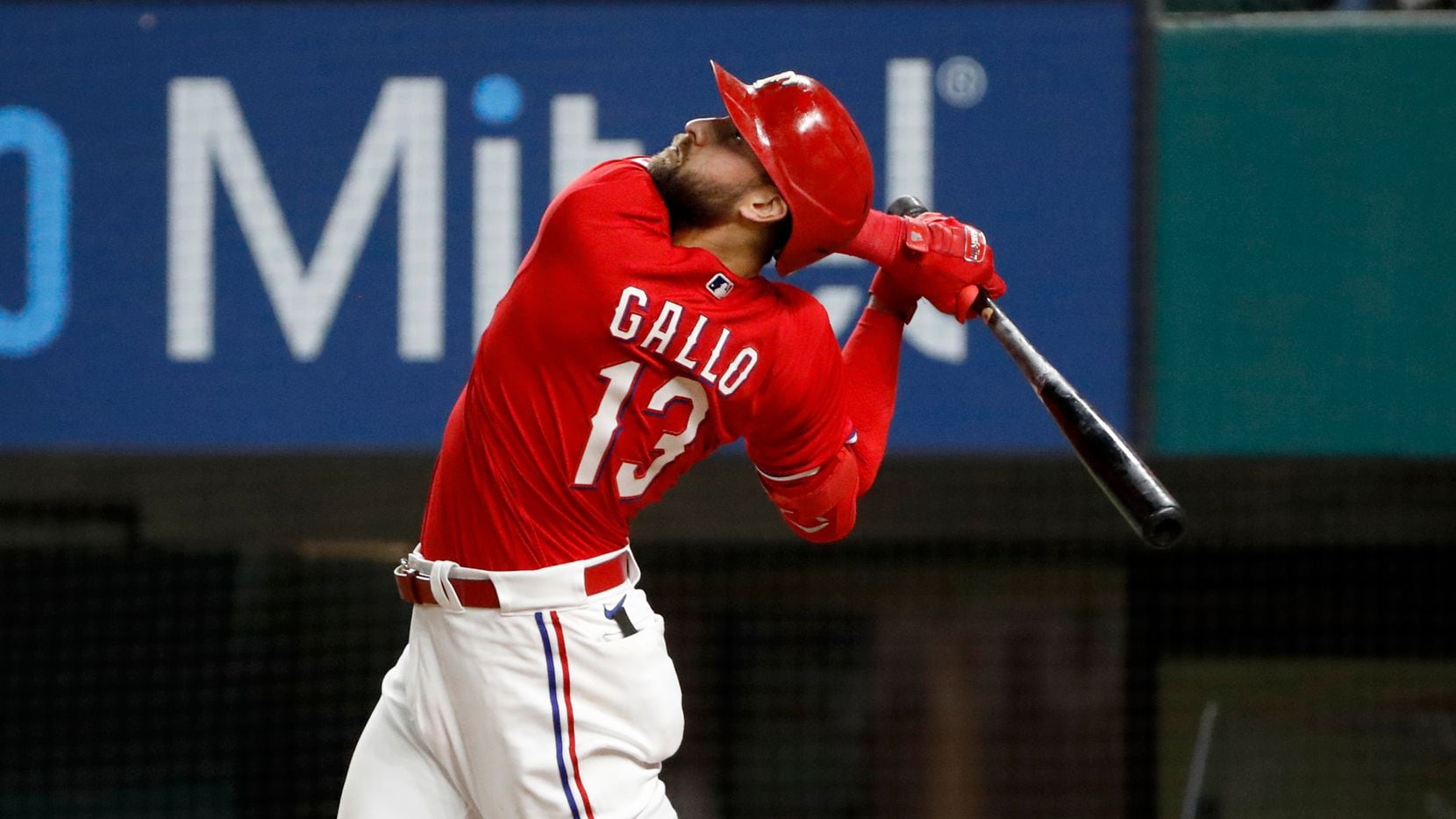 Texas Rangers Joey Gallo watches a fly ball during the ninth inning of a baseball game against the Baltimore Orioles in Arlington, Texas, Friday, April 16, 2021. Texas lost the game 5-2.