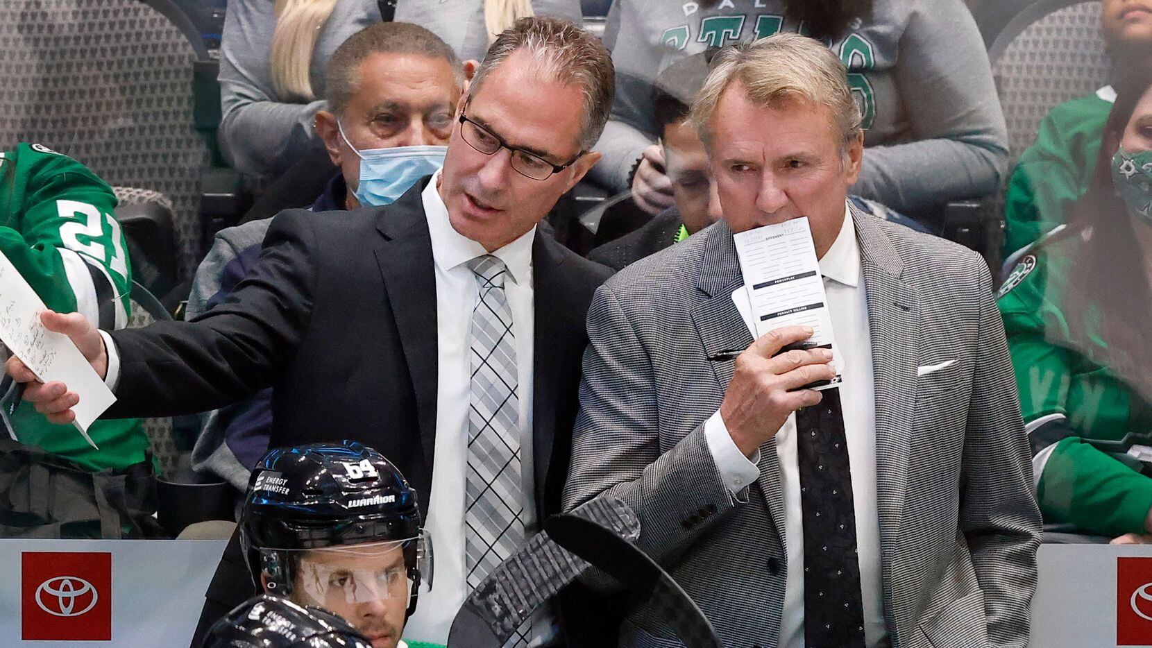 Dallas Stars assistant coach John Stevens (left) confers with head coach Rick Bowness during...