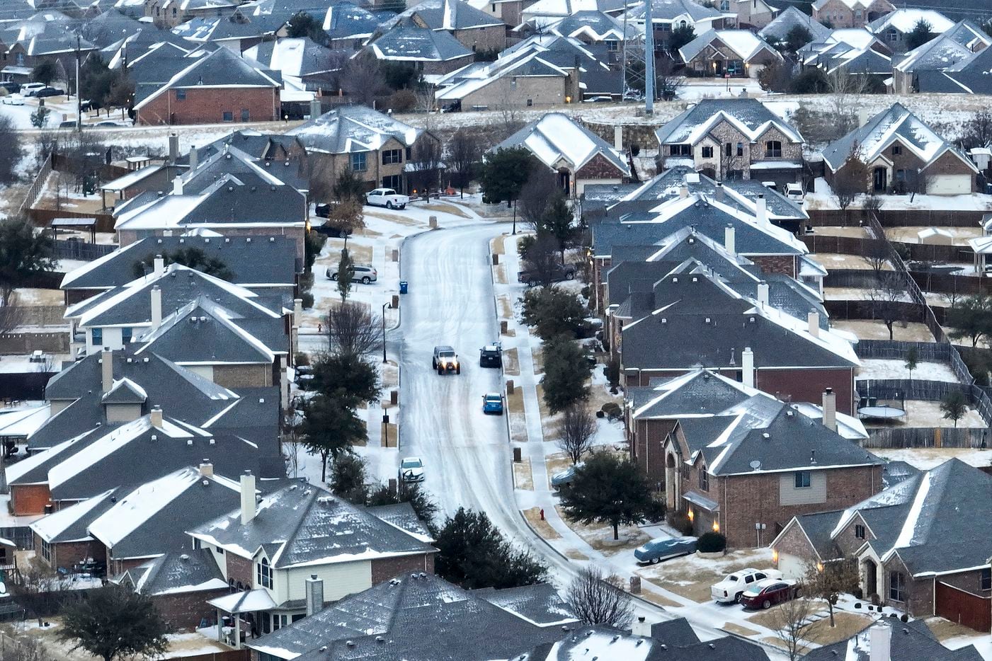 An icy mix covers a subdivision on Monday, Jan. 30, 2023, in Roanoke.  Dallas and other...