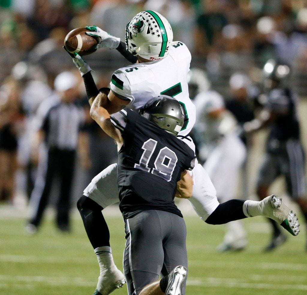 Southlake Carroll's Wills Meyer (5) catches a pass in front of Denton Guyer's Seth Meador...