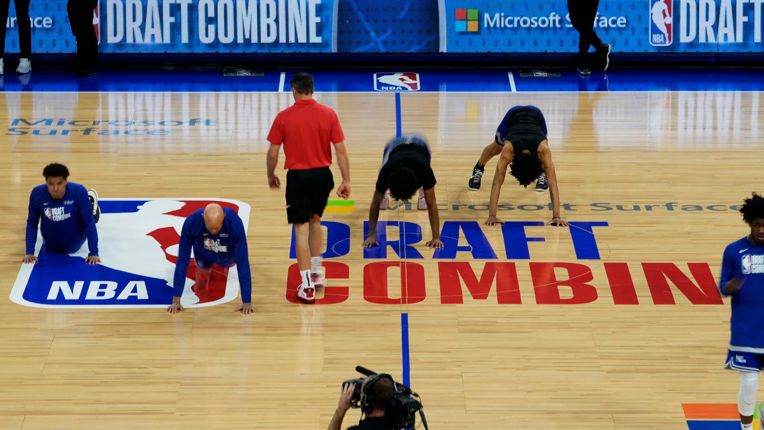 Participants warm up on the court during the 2023 NBA basketball Draft Combine in Chicago,...
