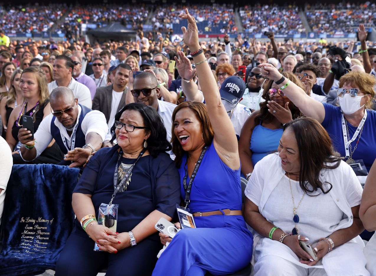 Sandra Pearson Hill (left), sister of Pro Football Hall of Fame inductee Drew Pearson of the Dallas Cowboys, daughter Tori Nichole Pearson (center) and Marsha Loggins cheer Drew who acknowledged them in his acceptance speech during the Class of 2021 enshrinement ceremony at Tom Benson Hall of Fame Stadium in Canton, Ohio, Sunday, August 8, 2021. (Tom Fox/The Dallas Morning News)