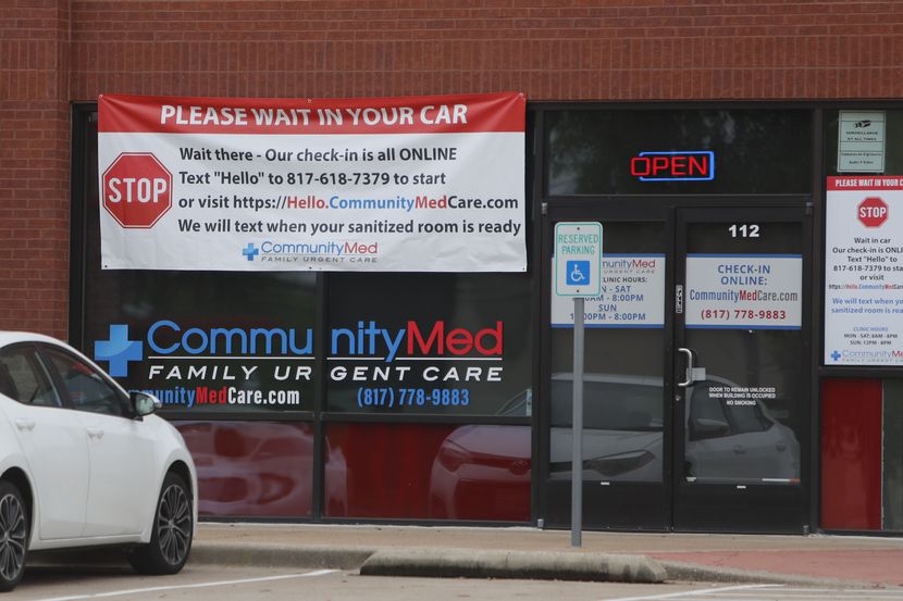 A car sits outside an urgent care facility in Arlington, Texas, Monday, March 23, 2020. In...