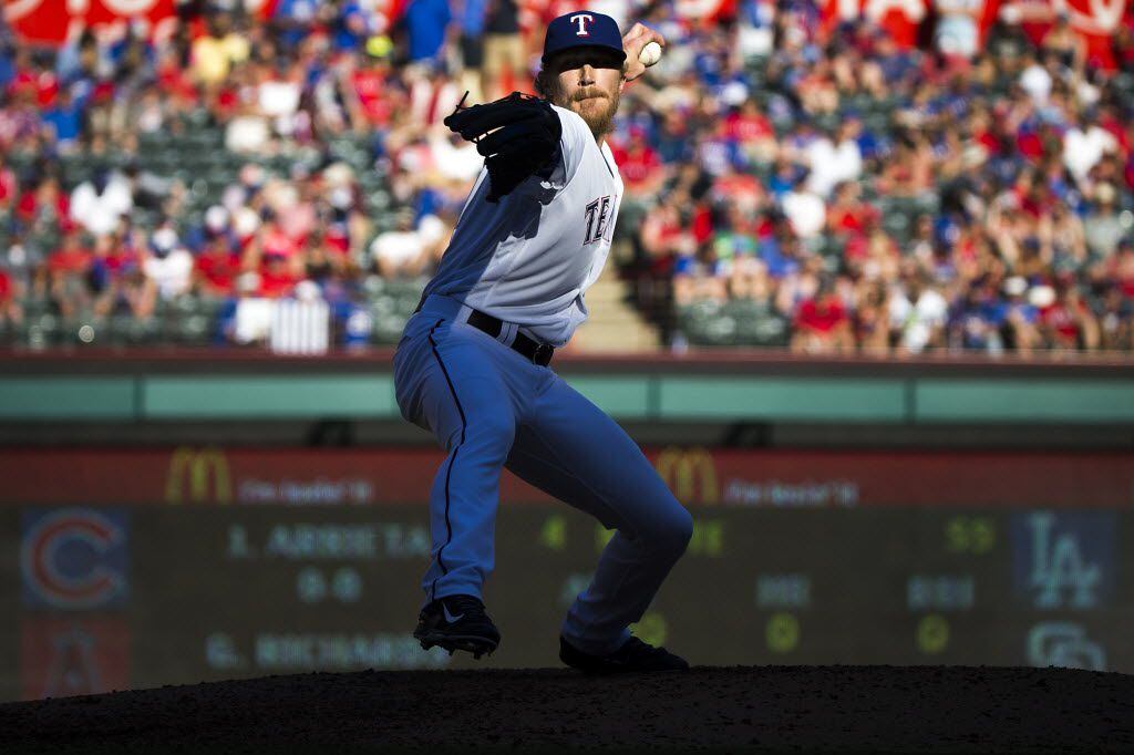 Texas Rangers relief pitcher Jake Diekman pitches during the eighth inning against the...