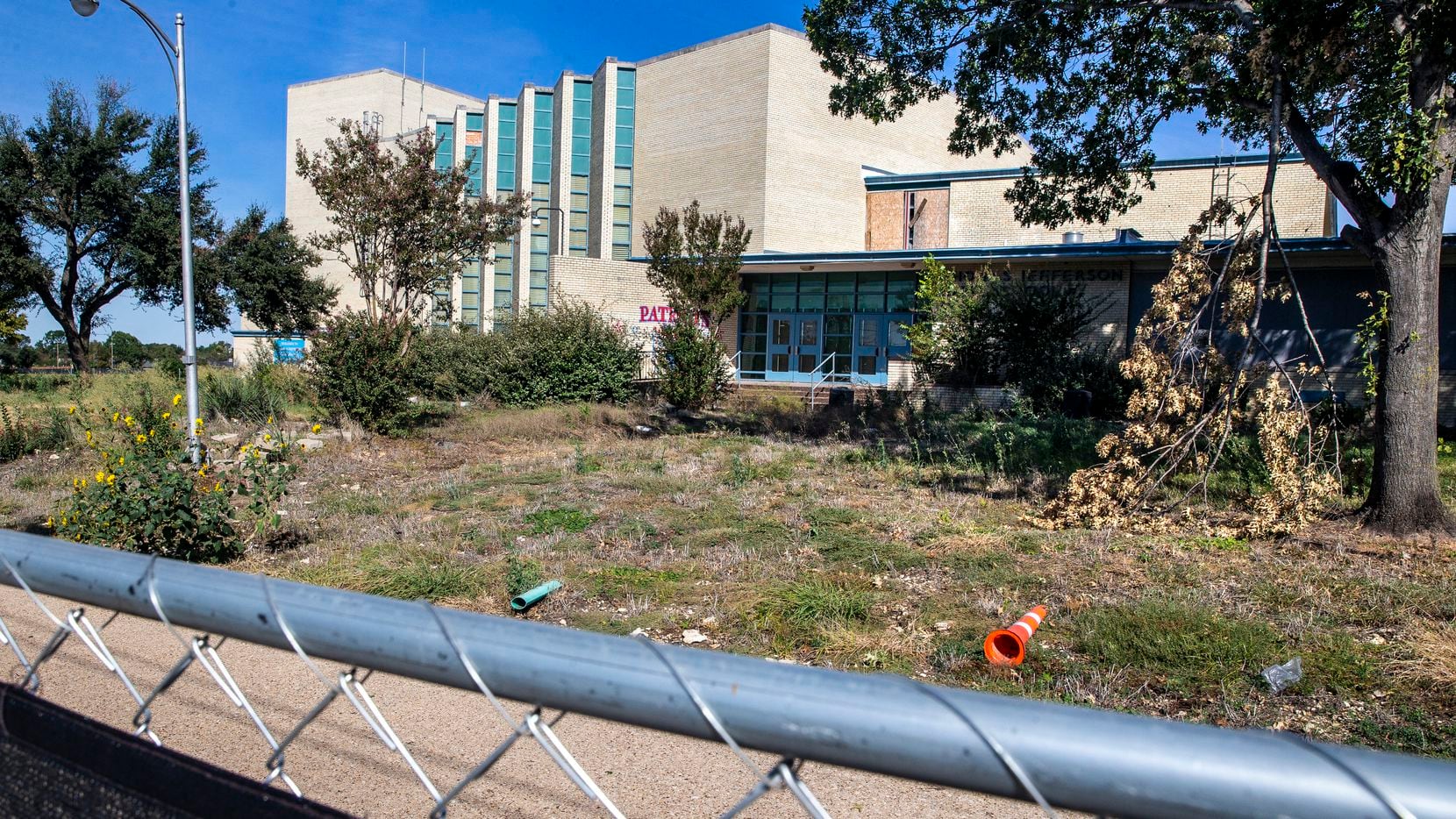 The dilapidated structure of Thomas Jefferson High School is photographed in Dallas on Friday, Oct. 16, 2020. The campus, along with Edward H. Cary Middle School, was destroyed by a tornado last October. The schools are still in desrepair, the latter having been demolished earlier this year, but the district says it's making some progress on renovating Thomas Jefferson High School. (Lynda M. González/The Dallas Morning News)
