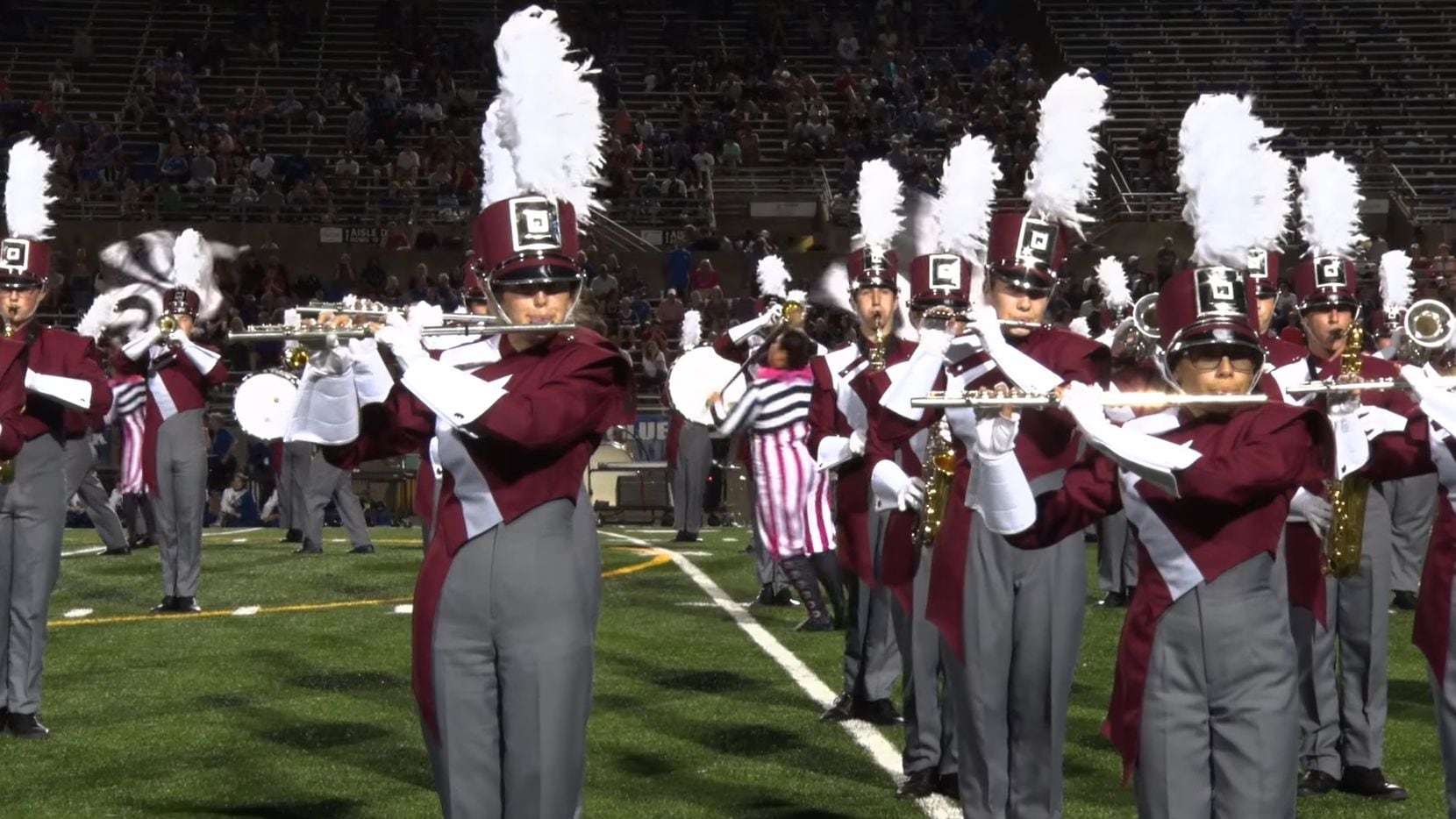 Members of the Plano Senior High School marching band are shown here in a screenshot of a...