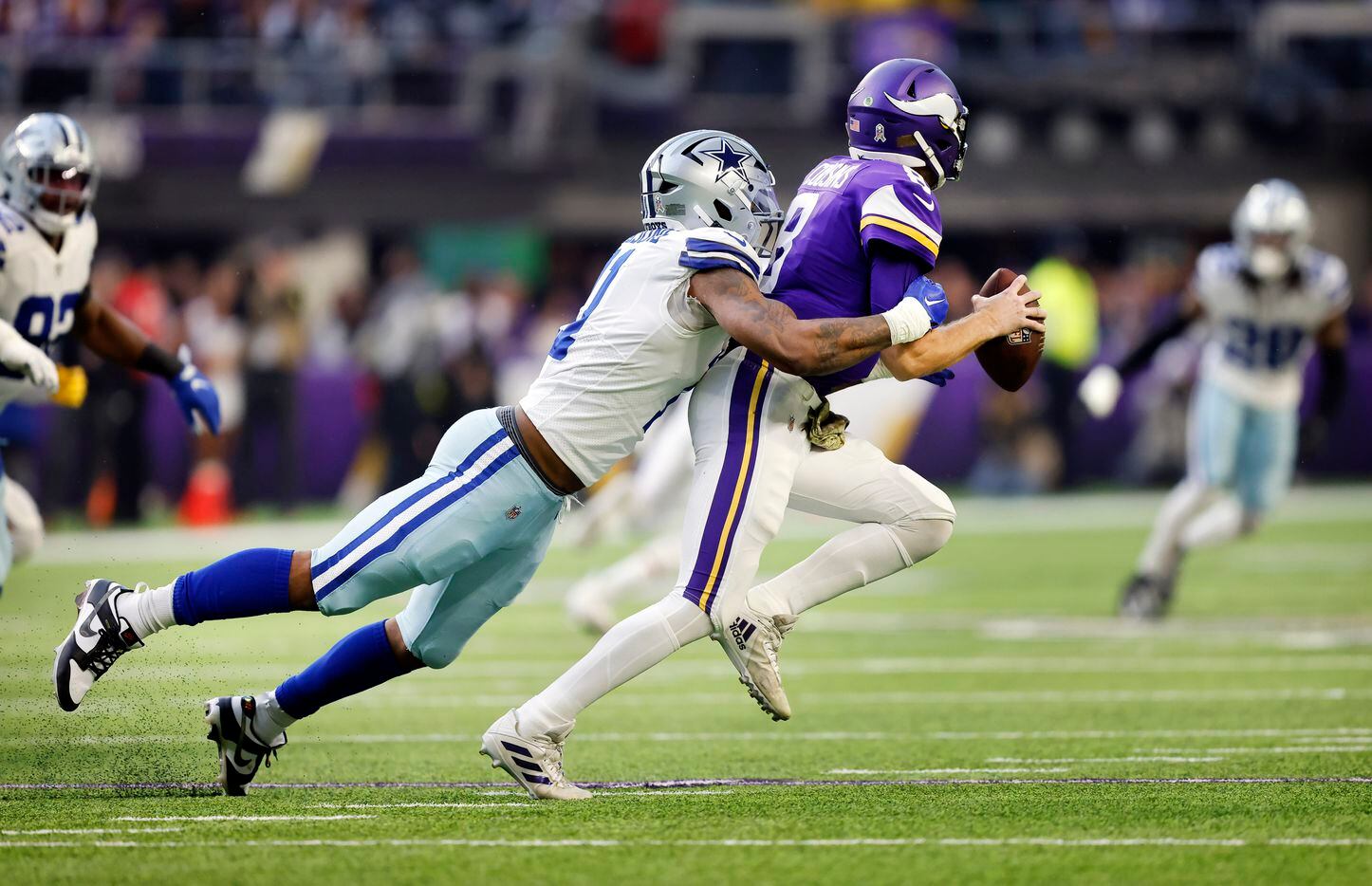 Dallas Cowboys linebacker Micah Parsons (11) forces Minnesota Vikings quarterback Kirk...