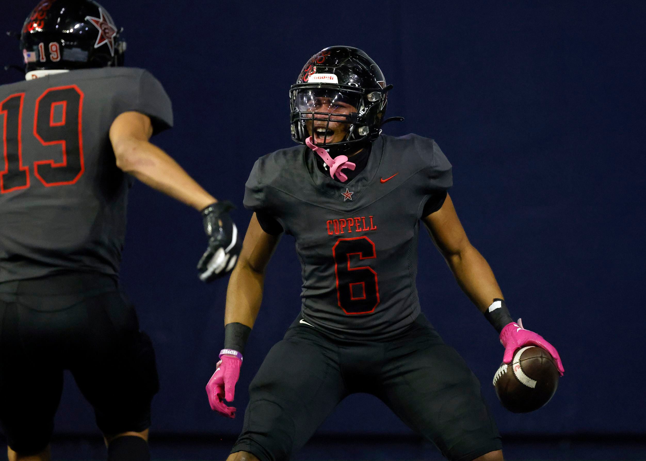 Coppell running back O’Marion Mbakwe (6) celebrates his fourth quarter touchdown run against...