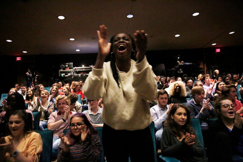 Mary Ukiri, a junior at Lake Highlands High School, cheers for her classmate as he performs...