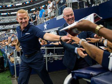 FILE - Jason Garrett and Cowboys VP Stephen Jones greet fans before a game between the Cowboys and New York Giants on Sunday, Sept. 8, 2019, at AT&T Stadium in Arlington.