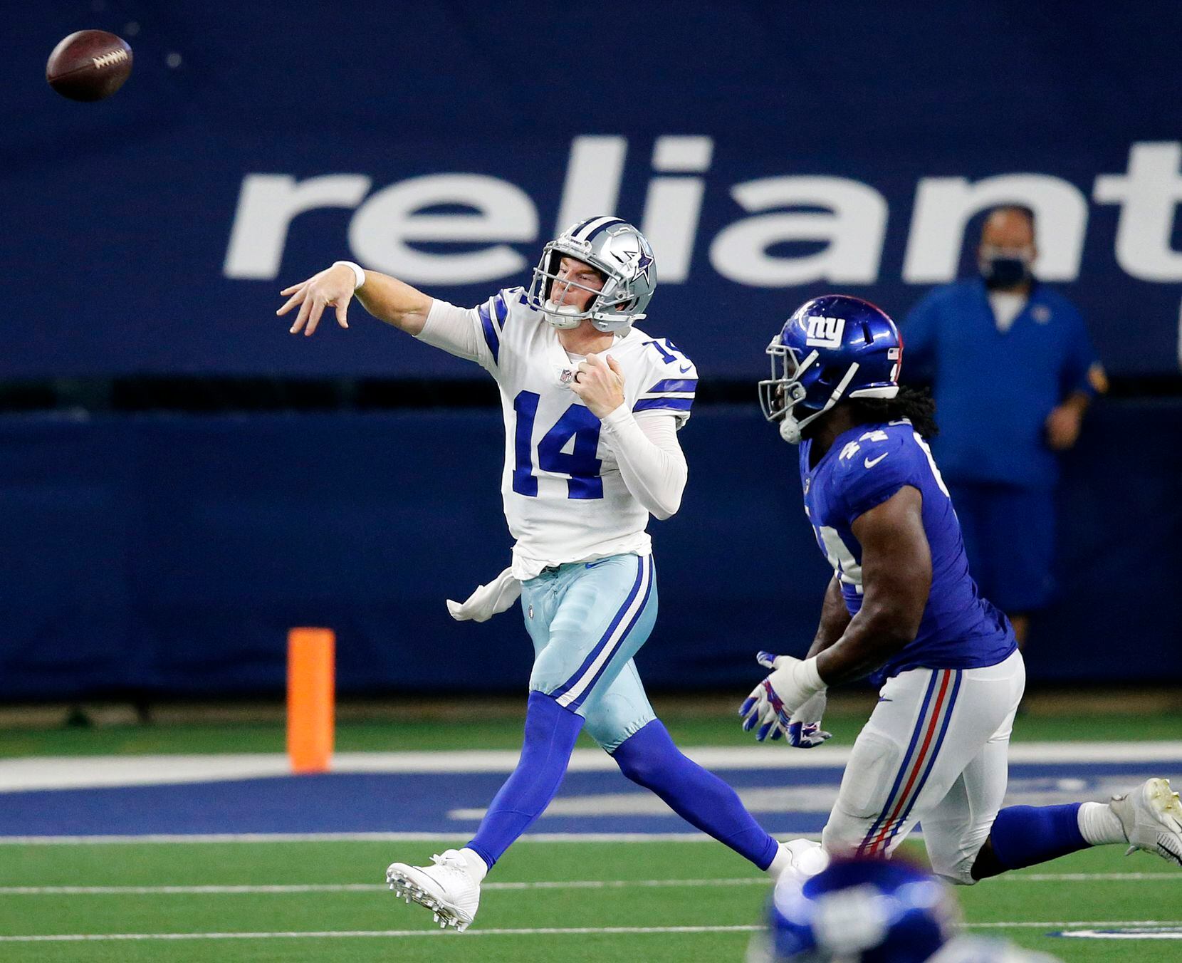 Dallas Cowboys quarterback Andy Dalton (14) tosses a pass on the run in the fourth quarter against the New York Giants at AT&T Stadium Stadium in Arlington, Texas, Sunday, October 11, 2020. The Cowboys defeated the Giants on a last second field goal, 37-34. (Tom Fox/The Dallas Morning News)