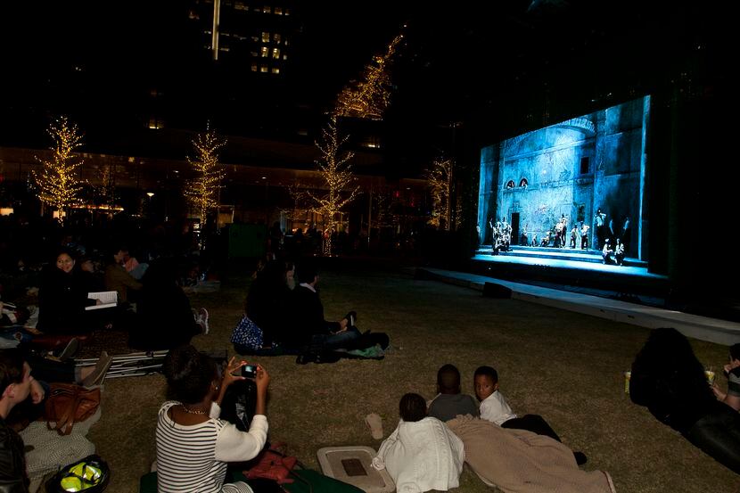 Guests watch the Dallas Opera’s simulcast at Klyde Warren Park.