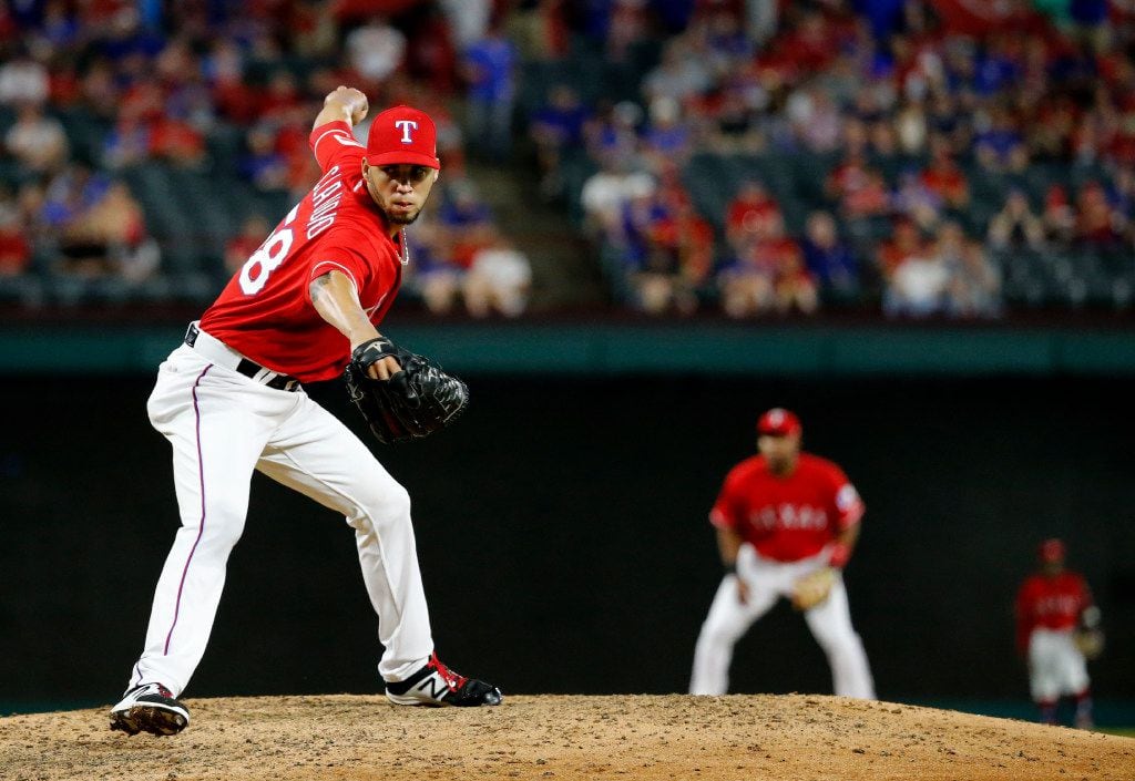 Texas Rangers relief pitcher Alex Claudio (58) pitches in the ninth inning against the...