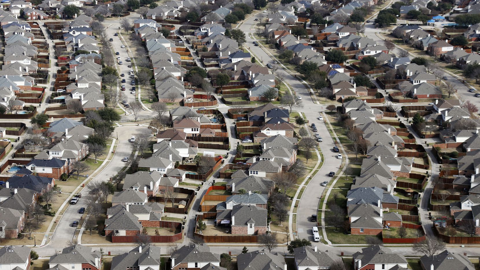 An aerial shot in 2019 shows rows of homes in Plano.