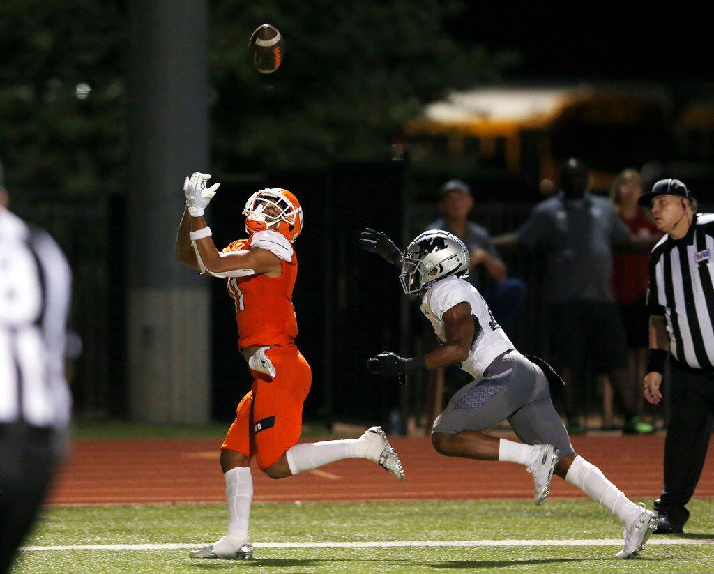Rockwall's Jaxon Smith-Njigba (11) catches a pass for a touchdown in front of Arlington...