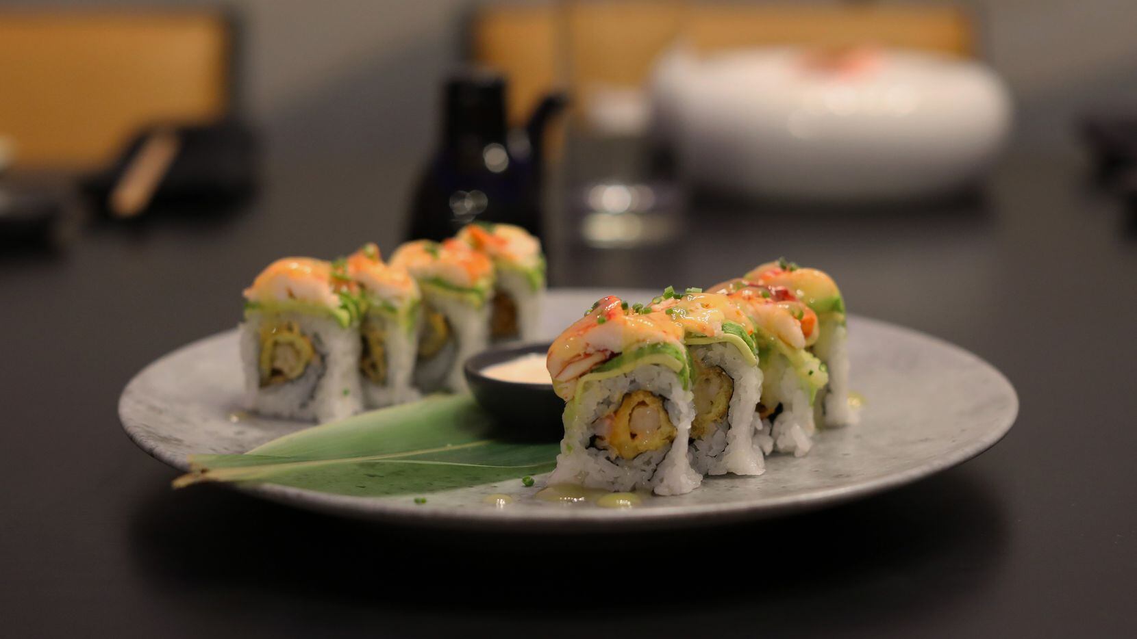 The Robusto Roll at Musume is a decadent dish with lobster, pressed avocado, tempura shrimp,...