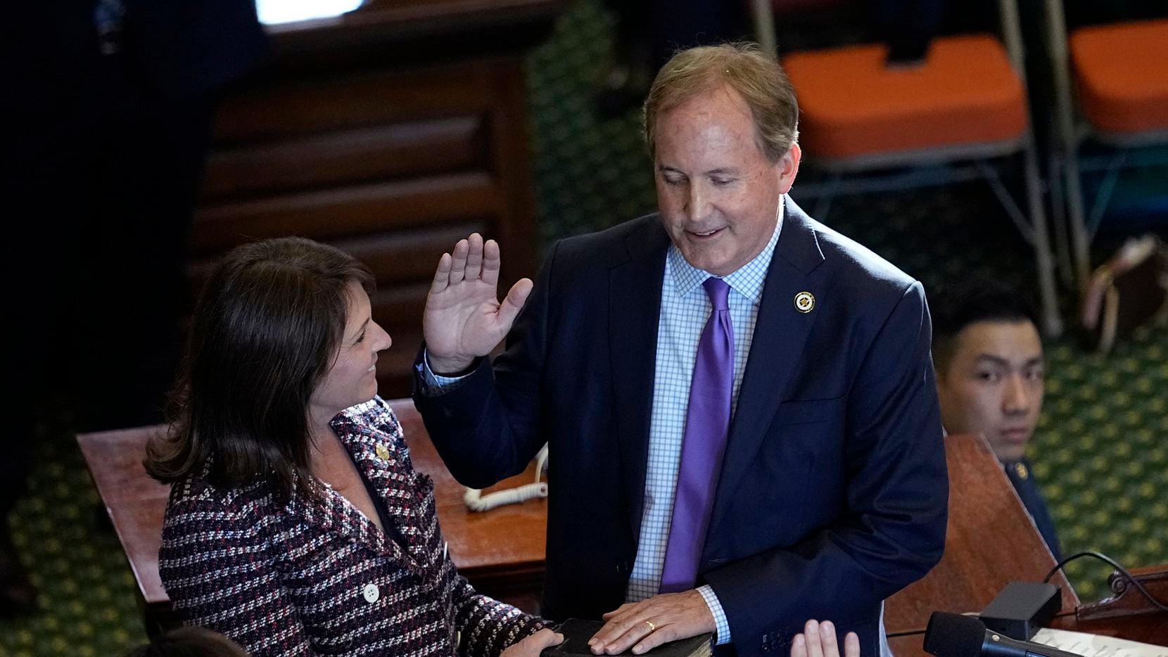Texas Attorney General Ken Paxton stands with his wife, Texas state Sen. Angela Paxton, as...
