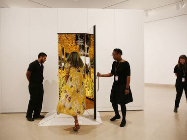 Guests enter during a preview of the exhibition 'Yayoi Kusama: All the Eternal Love I Have...