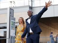 Former Dallas Cowboys defensive end DeMarcus Ware waves to fans as he arrives to the Dallas...