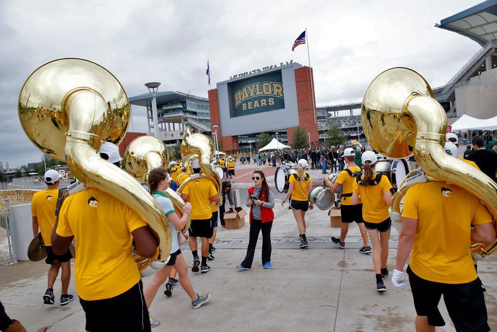 The Baylor band walks to the stadium before the TCU Horned Frogs play against the Baylor...