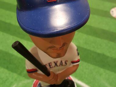 An Alex Rios bobblehead from the collection of Johnnie Lehew. The Fort Worth resident has...