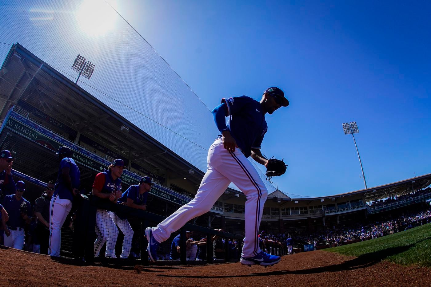 Texas Rangers infielder Marcus Semien takes the field for the startof a spring training game...