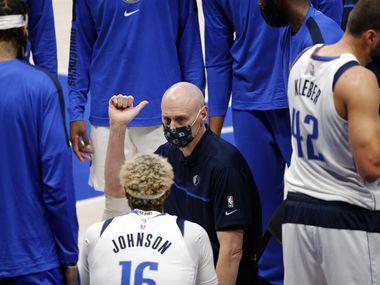 Dallas Mavericks head coach Rick Carlisle talks with his players during a timeout during the first quarter of a preseason game with the Minnesota Timberwolves at the American Airlines Center in Dallas, Thursday, December 17, 2020. (Tom Fox/The Dallas Morning News) 